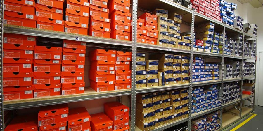 Footwear shelving racks full of shoe boxes